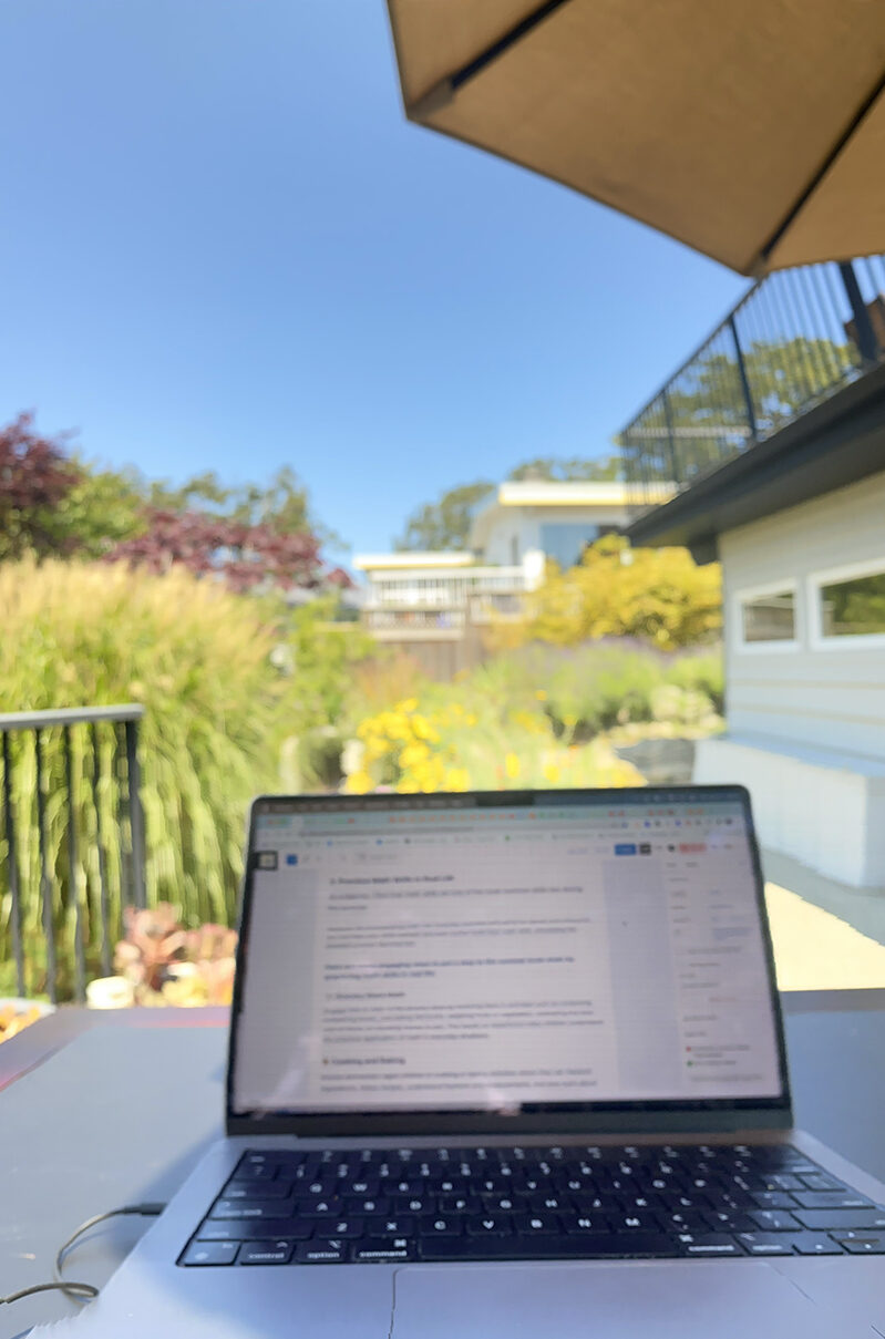A picture of Donna's laptop on our outdoor workspace at a pet sit. Super grateful for our nomadic office.