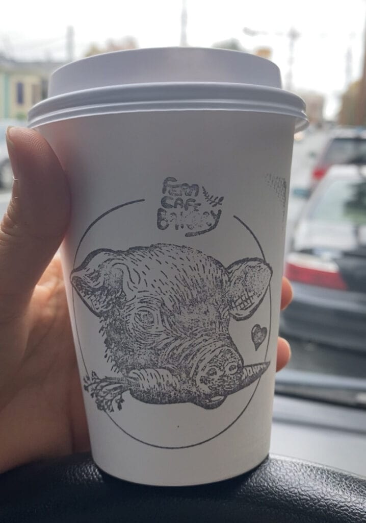 A picture of a coffee cup. We like to support local vegan eateries when we are pet sitting in new places.