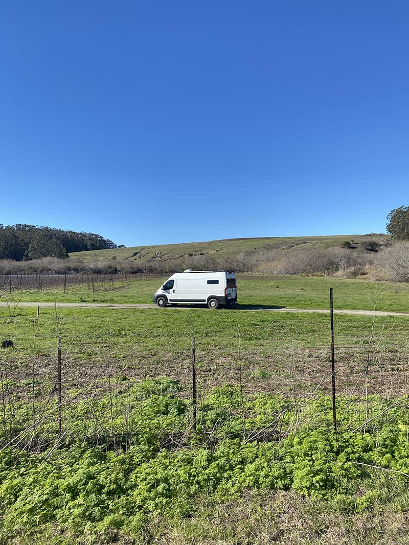 A picture of our van on the berry farm in Pescadero, California. Even though this is a Trusted Housesitters review, we just want to say that Boondockers Welcome is amazing as well.