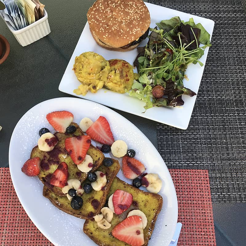 Two delicious plates of vegan food from a local restaurant.