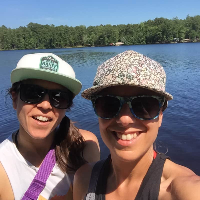 Donna and Karen smiling selfie at the lake.