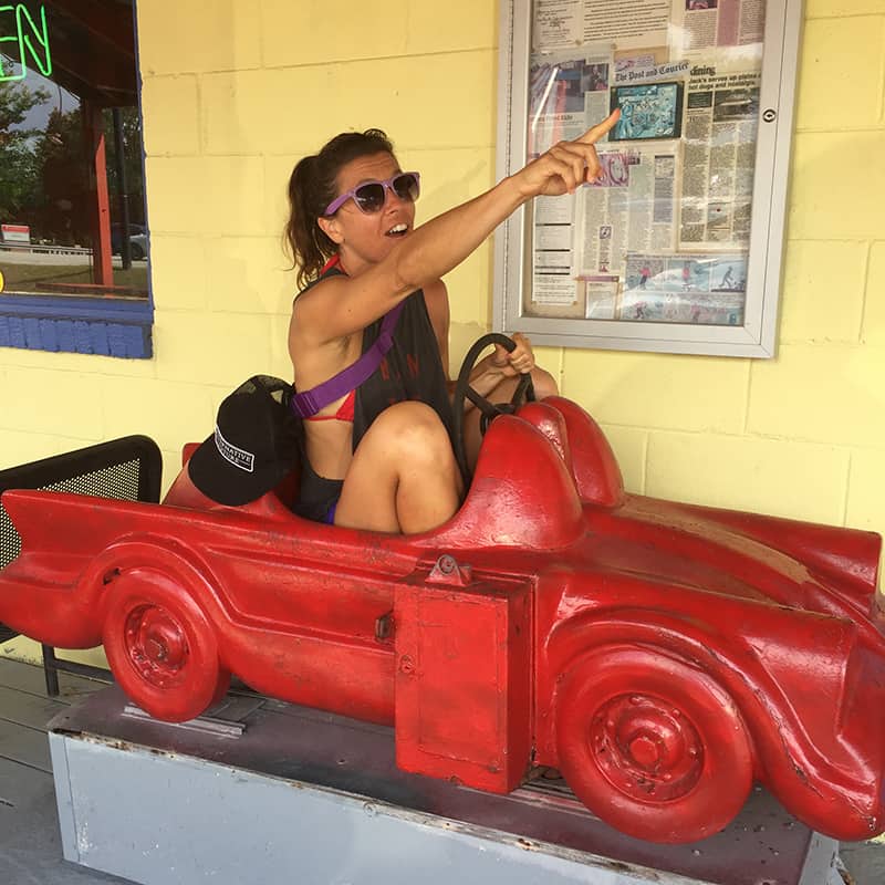 Donna having fun outside of a local diner that serves vegan hot dogs in South Carolina.