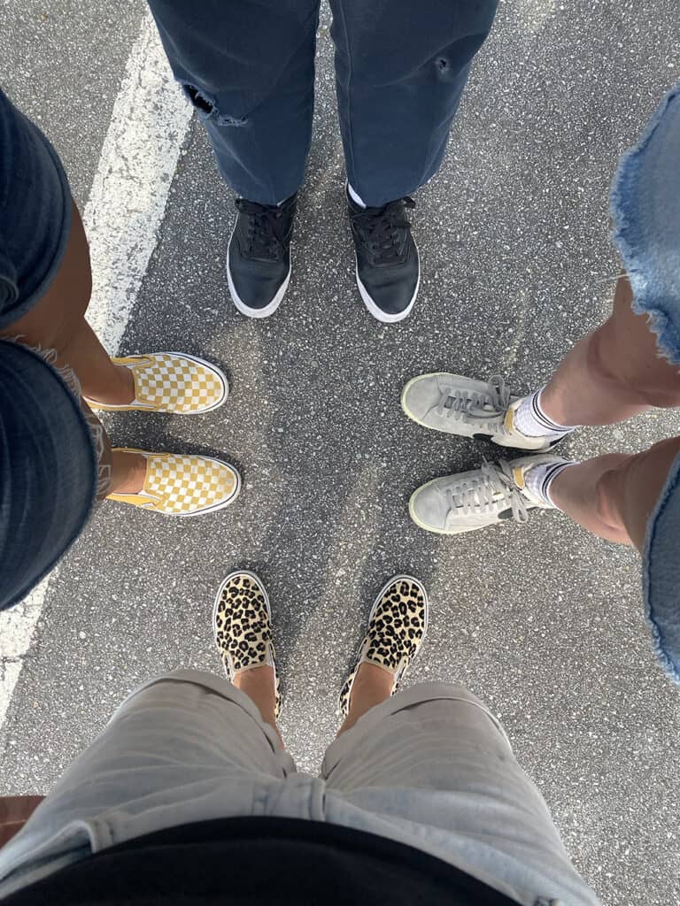 A picture of our feet with the feet of our new friends who we met through Trusted Housesitters.